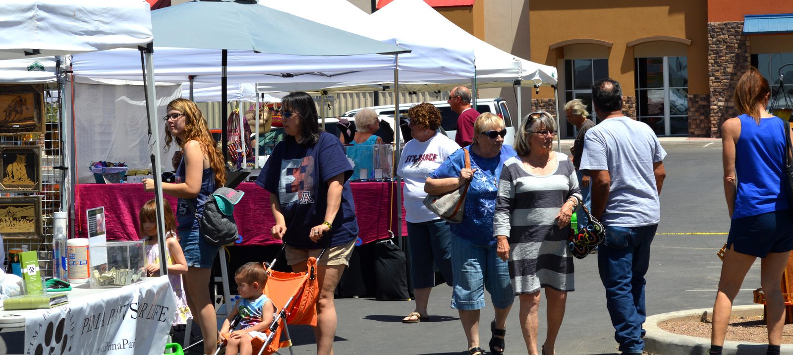Shoppers walking the booths at a Kevin's Art Attack festival